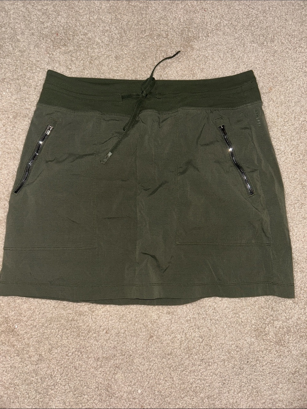 Athleta Olive Green Drawstring Mini Skirt with Zip Pockets
